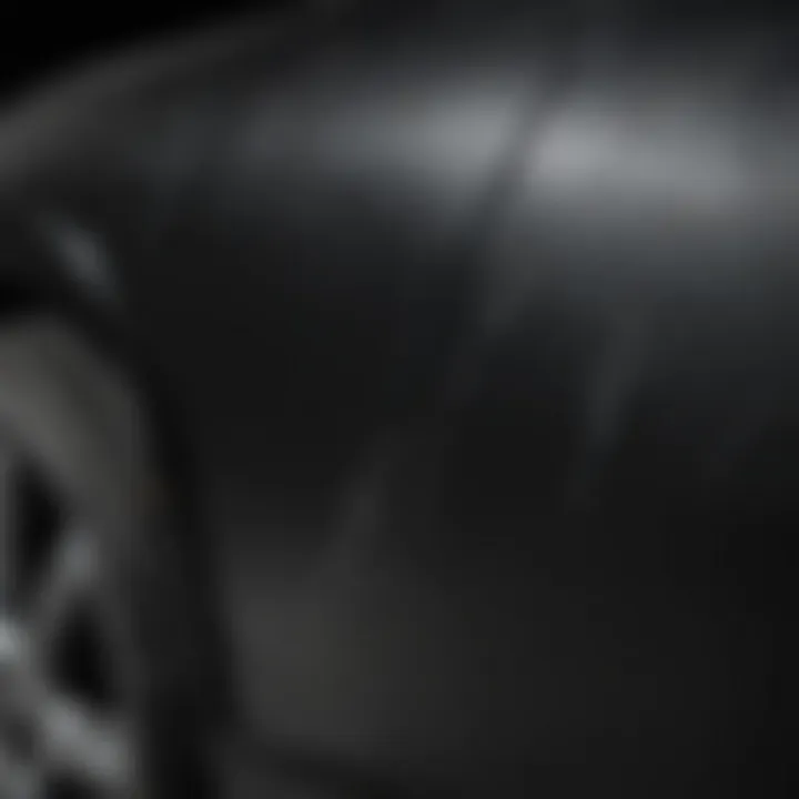 Close-up of scratches on black car paint