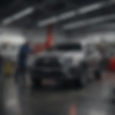 Service department with technicians working on vehicles