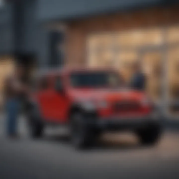 Happy customer receiving keys to their new Jeep from the dealership staff