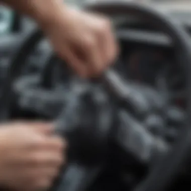 Close-up view of a steering wheel lock being applied to a steering wheel.