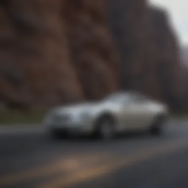 An elegant profile of a used Cadillac sports car on a scenic road.